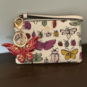 Coach corner Zip Wristlet Wallet With Creature Print And Butterfly Charm